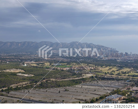 Expansion reaches mountainside elements, City spreading towards hills with sparse foreground features Expansion reaches mountainside elements, City spreading towards hills with sparse foreground features 138203254
