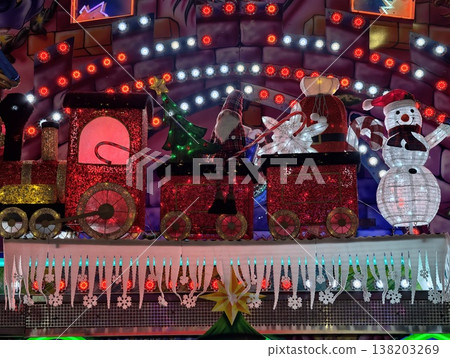 Festive holiday scene, Colorful holiday arrangement featuring festive ornaments and glowing lights Festive holiday scene, Colorful holiday arrangement featuring festive ornaments and glowing lights 138203269