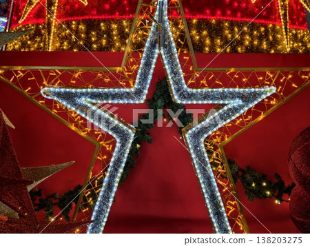 Bright star with radiant details, Decorative star glowing with shimmering accents and holiday sparkle Bright star with radiant details, Decorative star glowing with shimmering accents and holiday sparkle 138203275