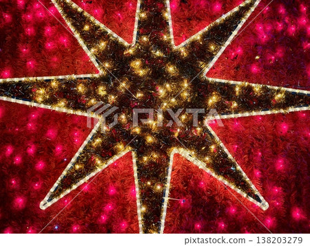 Dramatic crimson star symbol featuring radiant lighting and high contrast for seasonal displays Dramatic crimson star symbol featuring radiant lighting and high contrast for seasonal displays 138203279