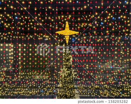 Seasonal lighting installation transforms public area into lively celebration during night hours Seasonal lighting installation transforms public area into lively celebration during night hours 138203282