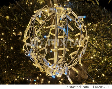 Decorative wire sphere with blue glow, Illuminated spherical wire with vibrant blue festive lighting Decorative wire sphere with blue glow, Illuminated spherical wire with vibrant blue festive lighting 138203292