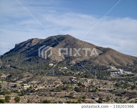 Serene countryside with scattered homes, Tranquil hilltop area with sparse dwellings and olive bushes 138203366