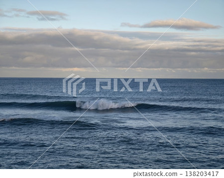 Peaceful ocean with gentle waves, Tranquil maritime environment with distant horizon and reflective tones 138203417