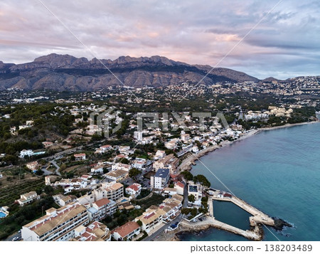 Coastal landscape with serene waters, Aerial shot highlighting gentle waves and tranquil coastal scenery Coastal landscape with serene waters, Aerial shot highlighting gentle waves and tranquil coastal scenery 138203489