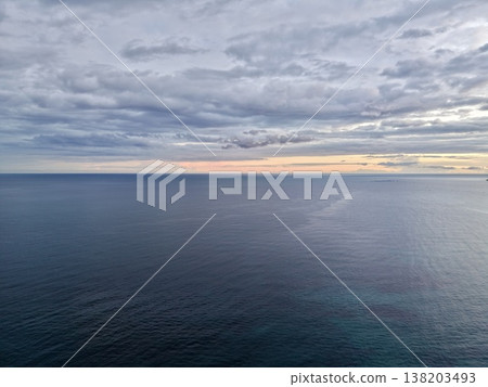 Serene horizon scene, Calm scene where gentle clouds and steady land symbolize enduring strength and hope Serene horizon scene, Calm scene where gentle clouds and steady land symbolize enduring strength and hope 138203493