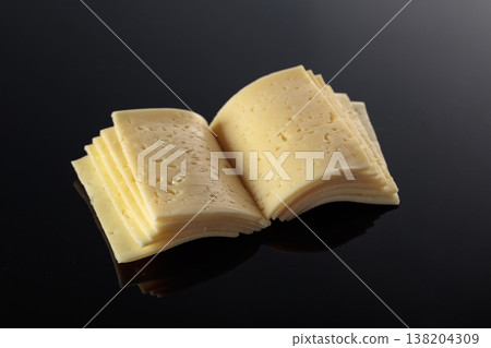 Cheese slices folded like an open book. Cheese slices folded like an open book. 138204309