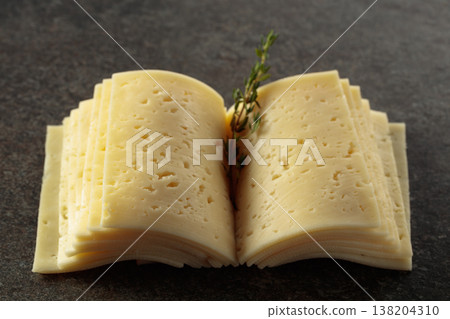 Cheese slices folded like an open book. 138204310