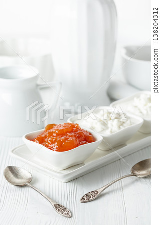 Cottage cheese with quince jam. 138204312