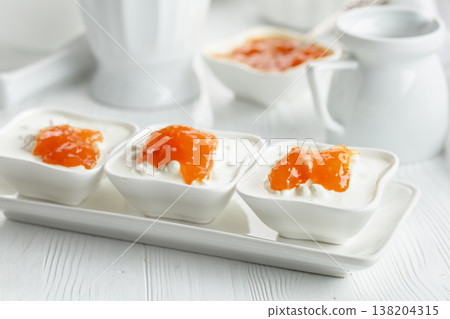 Cottage cheese with quince jam. Cottage cheese with quince jam. 138204315