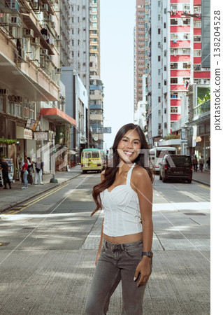 Asian Woman Smiling on Kennedy Town Street Hong Kong Asian Woman Smiling on Kennedy Town Street Hong Kong 138204528