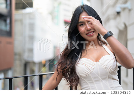 Asian Woman Smiling on Balcony in Central Hong Kong 138204555
