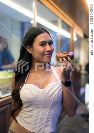 Thai Woman Holding Egg Tart on Hong Kong Street Thai Woman Holding Egg Tart on Hong Kong Street 138204590