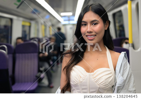 Asian Woman Riding Subway Train in Hong Kong 138204645