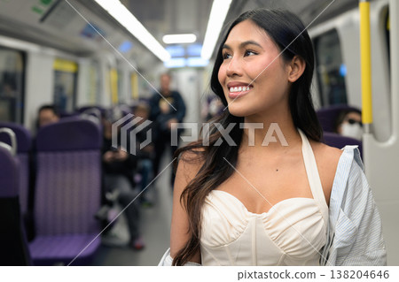 Asian Woman Riding Subway Train in Hong Kong Asian Woman Riding Subway Train in Hong Kong 138204646