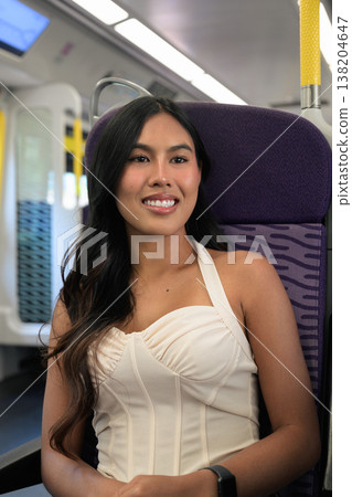 Asian Woman Riding Subway Train in Hong Kong Asian Woman Riding Subway Train in Hong Kong 138204647