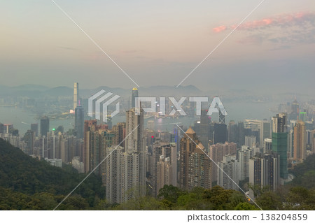 Hong Kong city skyline glows softly at twilight. Hong Kong city skyline glows softly at twilight. 138204859