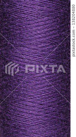 macro texture of a skein of purple sewing thread 138204880