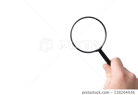 lens, black magnifying glass in hand in hand on a white background 138204936