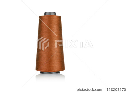 spool of industrial threads of brown color, texture of threads on a white background 138205270