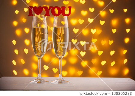 beautiful glasses of champagne on a blurred background of hearts beautiful glasses of champagne on a blurred background of hearts 138205288