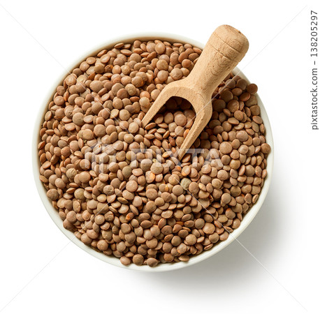 Bowl of brown lentils with wooden spoon isolated on white background, top view Bowl of brown lentils with wooden spoon isolated on white background, top view 138205297