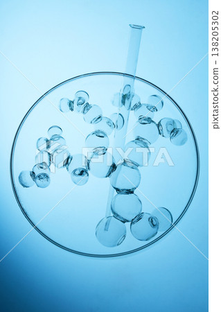Abstract cosmetic lab. Glass molecule structure with test tube in petri dish Abstract cosmetic lab. Glass molecule structure with test tube in petri dish 138205302
