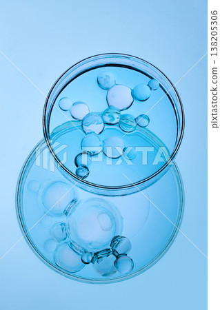 Abstract cosmetic lab. Molecule model from water drops in petri dish Abstract cosmetic lab. Molecule model from water drops in petri dish 138205306