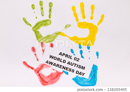 Kids handprint made of paint and inscription April 02 World Autism Awareness Day Kids handprint made of paint and inscription April 02 World Autism Awareness Day 138205405