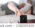 Hand Reaching for the Alarm Clock 138205420