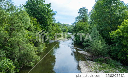 Serene River Landscape Surrounded by Lush Green Vegetation in Bulgaria Serene River Landscape Surrounded by Lush Green Vegetation in Bulgaria 138205581