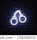 Neon handcuffs icon shining in white light on brick background. Strong outline conveys passion and daring lifestyle concept. Suitable for club decor, themed posters, or bold design projects. 138206015