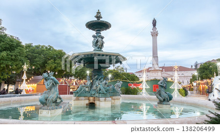 Decorative fountain in city square surrounded by Christmas market Decorative fountain in city square surrounded by Christmas market 138206499