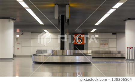 Row of airport luggage carts with blue handles  138206504