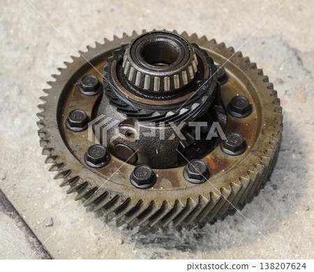 Dismantled box car transmissions. Gear with bearings. The gears on the shaft of a mechanical transmission. Dismantled box car transmissions. Gear with bearings. The gears on the shaft of a mechanical transmission. 138207624