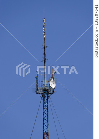 Communication tower with repeaters and satellite dish 138207641