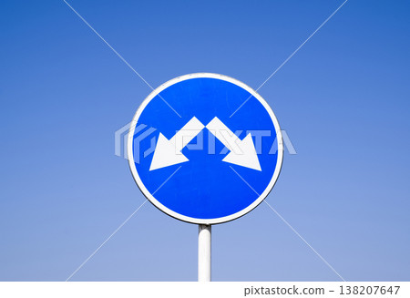 The sign of the crossing. Road signs. Sign on a blue background The sign of the crossing. Road signs. Sign on a blue background 138207647