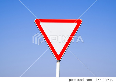 Road signs, give way. Sign on a blue background Road signs, give way. Sign on a blue background 138207649