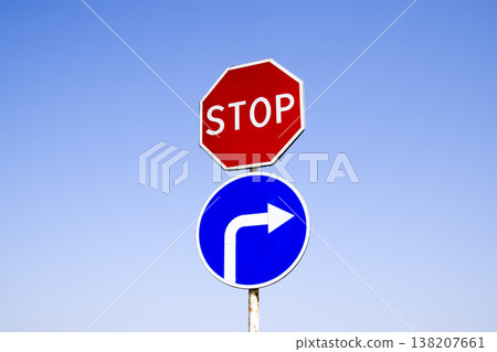 The road sign is stop. sign turn right. The road sign is stop. sign turn right. 138207661