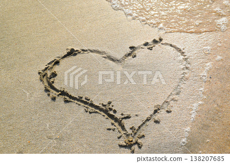 Heart drawn on the beach sand 138207685