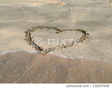 Heart drawn on the beach sand 138207689