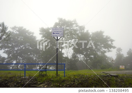 A signpost to Dumps in the misty forest A signpost to Dumps in the misty forest 138208495