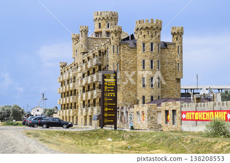 The hotel building, covered with decorative stone. Multi-storey hotel with a decorative trim, which is called Dagestani stone. 138208553