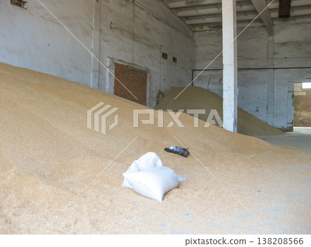 Heap of grains of barley and wheat in stock Heap of grains of barley and wheat in stock 138208566