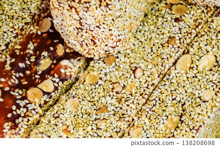 marmalade sticks with a nut, sprinkled with sesame. Indian sweets marmalade sticks with a nut, sprinkled with sesame. Indian sweets 138208698