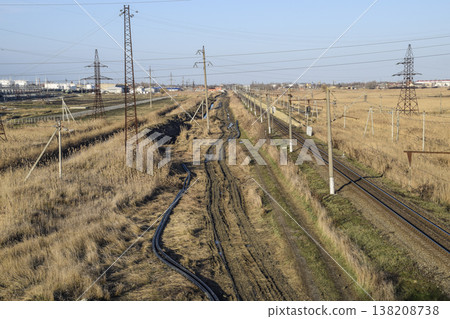Plot railway. Top view on the rails. High-voltage power lines for electric trains Plot railway. Top view on the rails. High-voltage power lines for electric trains 138208738