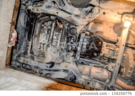 View of the car from below. Autoservice center. Car maintenance. View of the car from below. Autoservice center. Car maintenance. 138208776