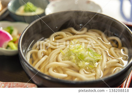 Delicious udon noodles. Topped with green onions. 138208818