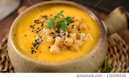 Creamy Butternut Squash Soup Topped with Roasted Chickpeas and Black Sesame Seeds 138209316