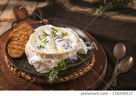 Baked Camembert Cheese with Rosemary and Garlic Served with Toasted Bread 138209317
